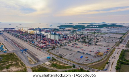 Aerial top view of container cargo ship in the export and import business and logistics international goods in urban city. Shipping to the harbor by crane in Laem Chabang, Chon Buri, Thailand Royalty-Free Stock Photo #1416506855