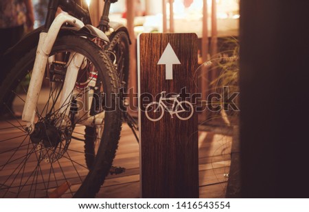 The Bicycle and Bicycle route signs on the wooden bridge.vintage style.