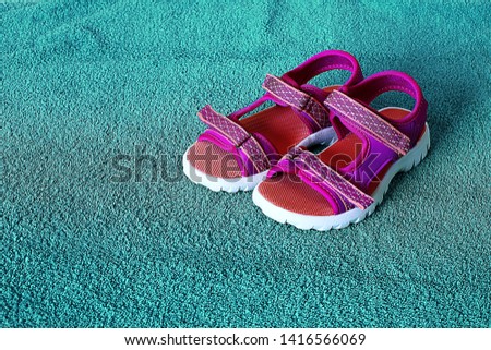 Comfortable women's beach sandals on a bright background, a place for an inscription on the background of a sabot for summer walks