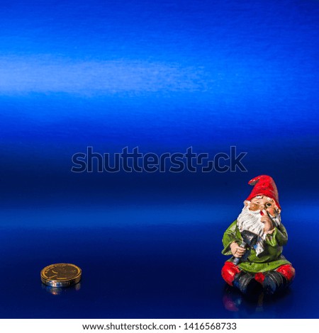 Garden gnome finished making a penny on a blue background.