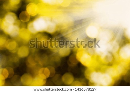Summer abstract bokeh background in yellow, gold colors. Blurred summer sunlight background.