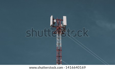 telecommunication radio mobile tower antenna on the vast blue sky background. Transmitter internet global telephone equipment