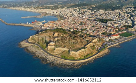 Aerial drone photo of unique Venetial castle of Fortezza built on a hill called Paleokastro by the sea in the heart of picturesque city of Rethymno, Crete island, Greece