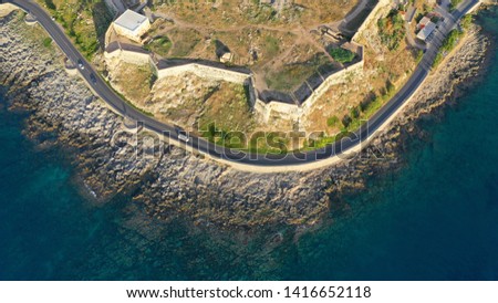 Aerial drone photo of unique Venetial castle of Fortezza built on a hill called Paleokastro by the sea in the heart of picturesque city of Rethymno, Crete island, Greece