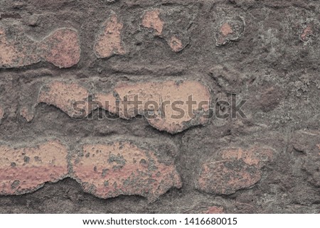 Fragment of an old brick wall close up. Industrial or loft style texture background