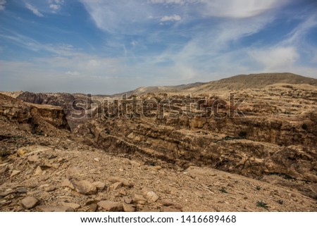 picturesque scenery landscape photography of wilderness and dangerous dry stone sharp rocky mountains and canyons natural environment in Middle East region of Earth, which belong to Bedouins 