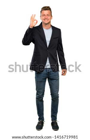 Blonde handsome man showing ok sign with fingers