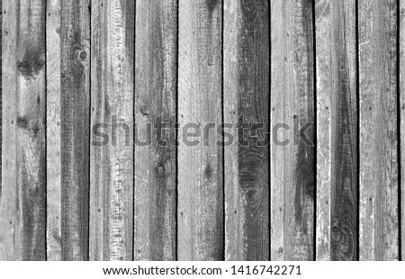 Old grungy wooden planks background in black and white. Abstract background and texture for design.