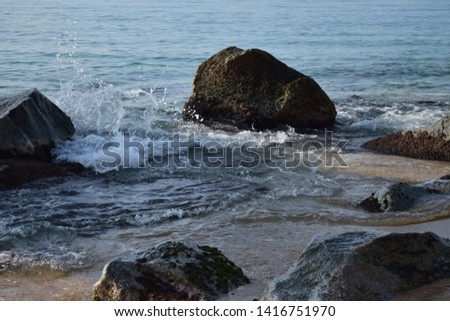 Small waves on blue water beach