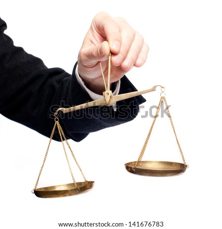 businessman hand holding a balance on white background