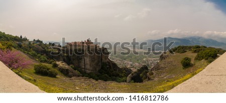 Beautiful scenic view of Monastery of St. Stephen, an Eastern Orthodox monastery at the background of stone wall in Meteora, Pindos Mountains, Thessaly, Greece. UNESCO World Heritage.