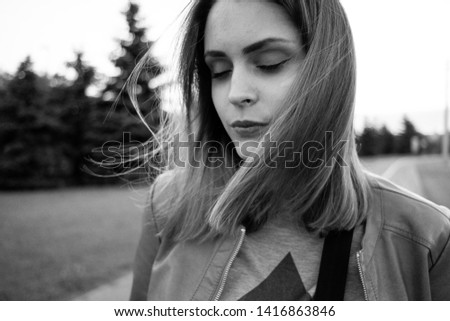  portraits of a young girl.Black and white.Close up.Hair develops in the wind