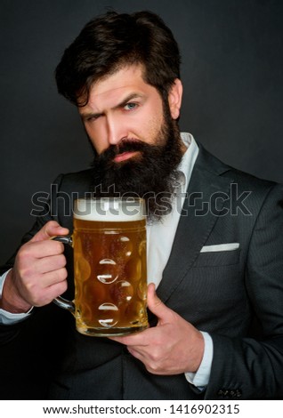 Bearded man drinking lager beer. Beer. Pub is relaxing place to have drink and relax