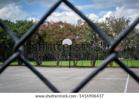 Looking at basketball court behind the fence