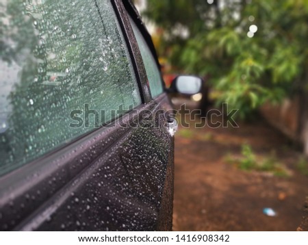 Water drops outside the car during rainy day