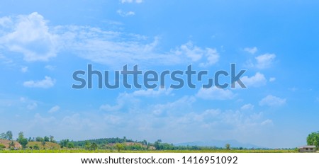 Beautiful Blue Sky and Mountains Background with White Clouds Panorama. Picture for Summer Season. Banner for Summer Concept.
