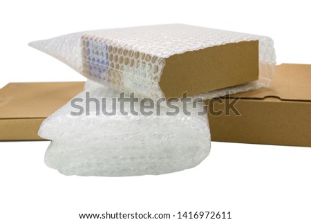 Bubbles covering the box by bubble wrap for protection product cracked  or insurance During transit -isolated white background 
