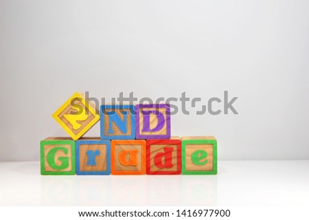 2nd Grade spelled out with ABC blocks. Royalty-Free Stock Photo #1416977900