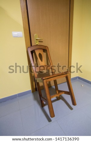 chair blocking the door to prevent entry