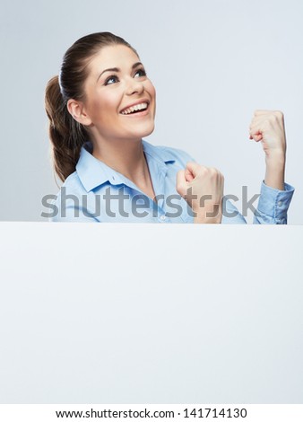 Successful young business woman portrait out the blank white banner.Female happy model.