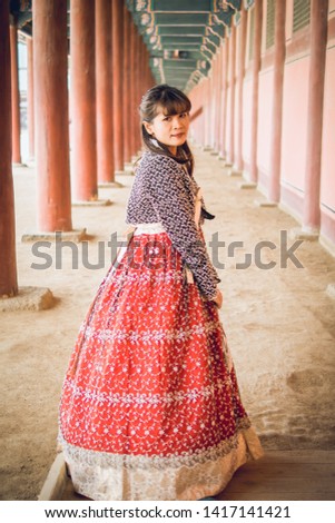 Young asian woman traveler in korean national dress or Hanbok.