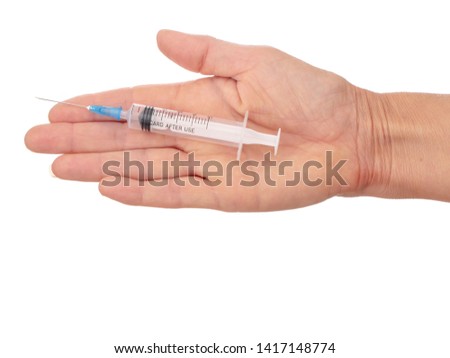 Woman's flat hand with plastic disposable, mono use syringe. Isolated on white background.