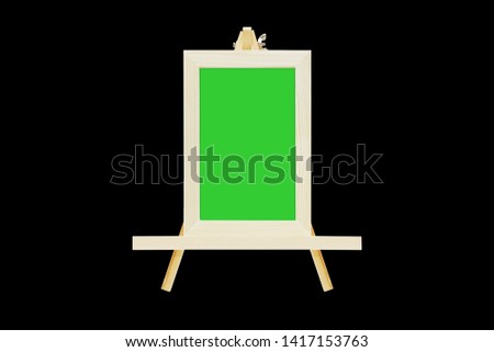 Picture frames of wood, vertical image green screen. on a black background (in the middle of the screen)