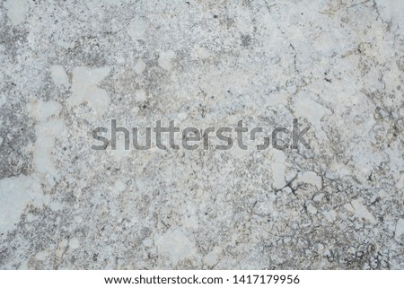 Concrete floor is contaminated with rainwater stains