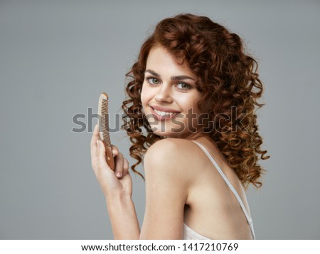 Smiling cute woman head care shampoo model gray background