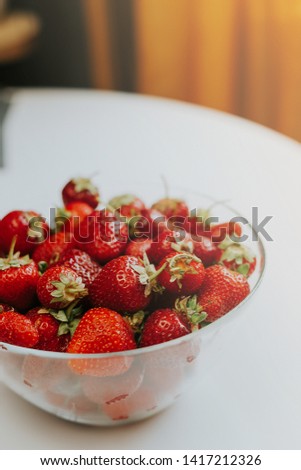 Strawberries in a transparent bowl