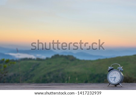 Alarm clock with natural scenery in the morning