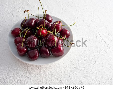 Beautiful delicious ripe cherry on white background on white background. Close up. Copy space.