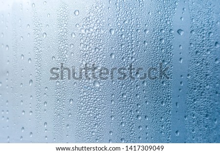 Condensation drops on window,autumn mood,background.