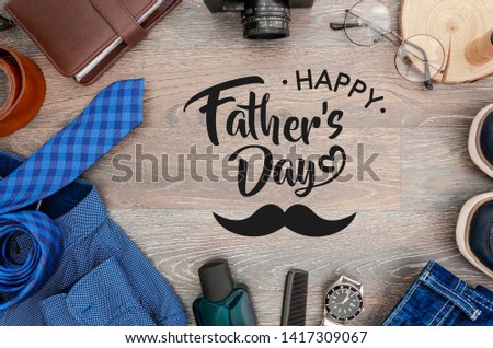 Top view men's accessories and clothes concept. Card with sign greeting text happy father's day