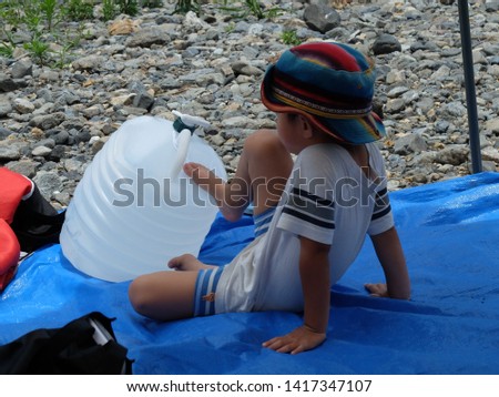 Asian little boy relaxing at outdoor