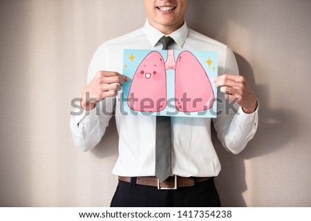 buinessman with healthy lung and smile happily