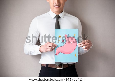 businessman with healthy stomach and smile happily