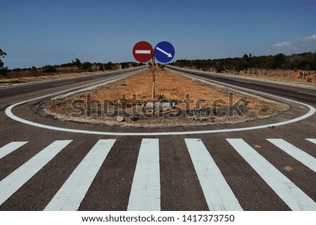 traffic signs on empty street