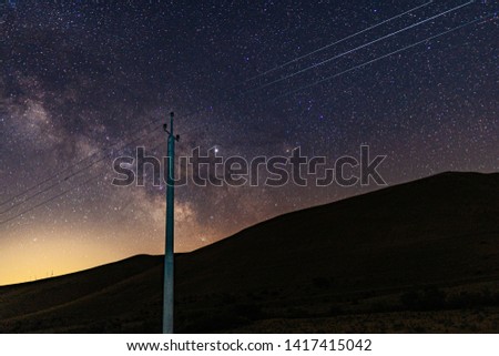 Power line against the night starry sky