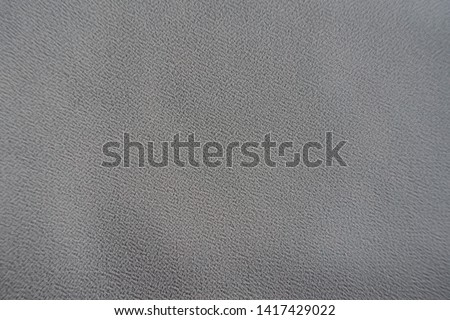 Surface of grey crepe georgette fabric from above