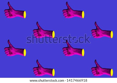 Contemporary minimalistic art collage in neon bold colors with hands showing thumbs up. Like sign surrealism creative wallpaper. Psychedelic design pattern. Template with space for text.  Royalty-Free Stock Photo #1417466918