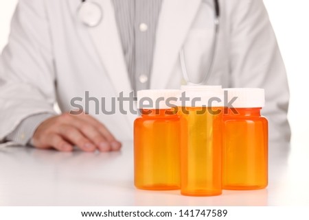 Male Doctor With Empty Orange Prescription Bottles