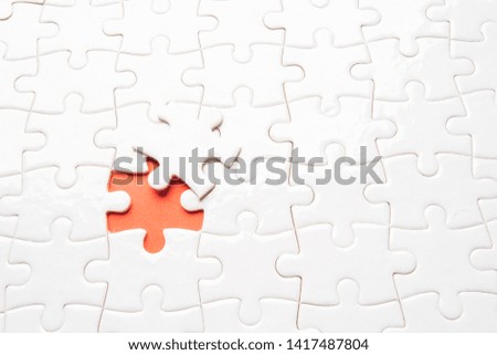 pieces of blank jigsaw puzzle for copy space, replacement words or text. Close up selective focus.