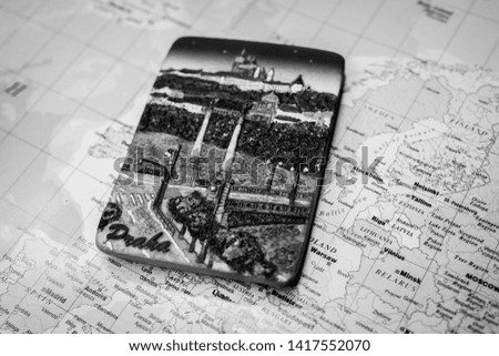 Souvenir from Prague magnet on the map of Europe travel background