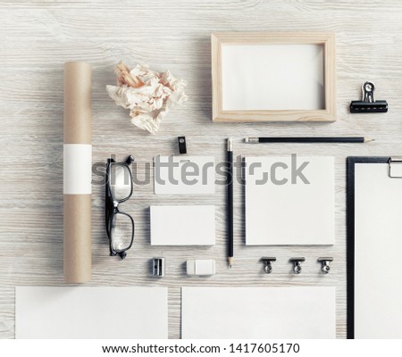 Blank corporate stationery on light wooden background. Template for branding design. Corporate identity set. Flat lay.