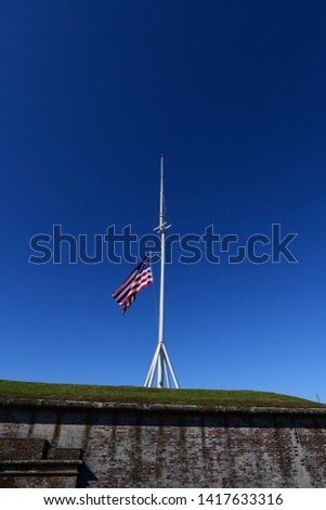 flag of the united states waving on a flag pole