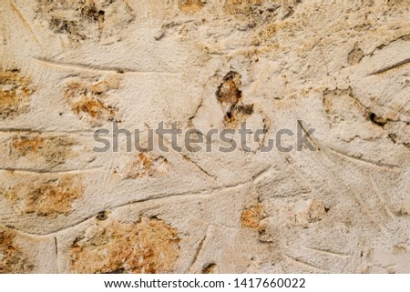 Background texture of an old masonry wall of limestone and cement.