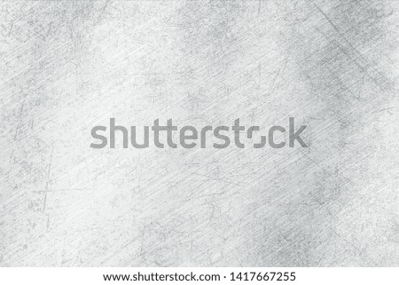 Brushed   metal texture. Polished metal texture background with light reflection.