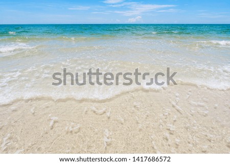 Landscape summer beach background with sunny sky at the sea. Horizon view of the sea, beach and wave with blue sky on background. Nature concept. Background concept. Close up with copy space.