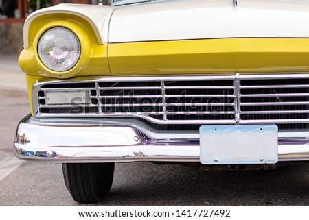 Yellow and White Classic Car Front end